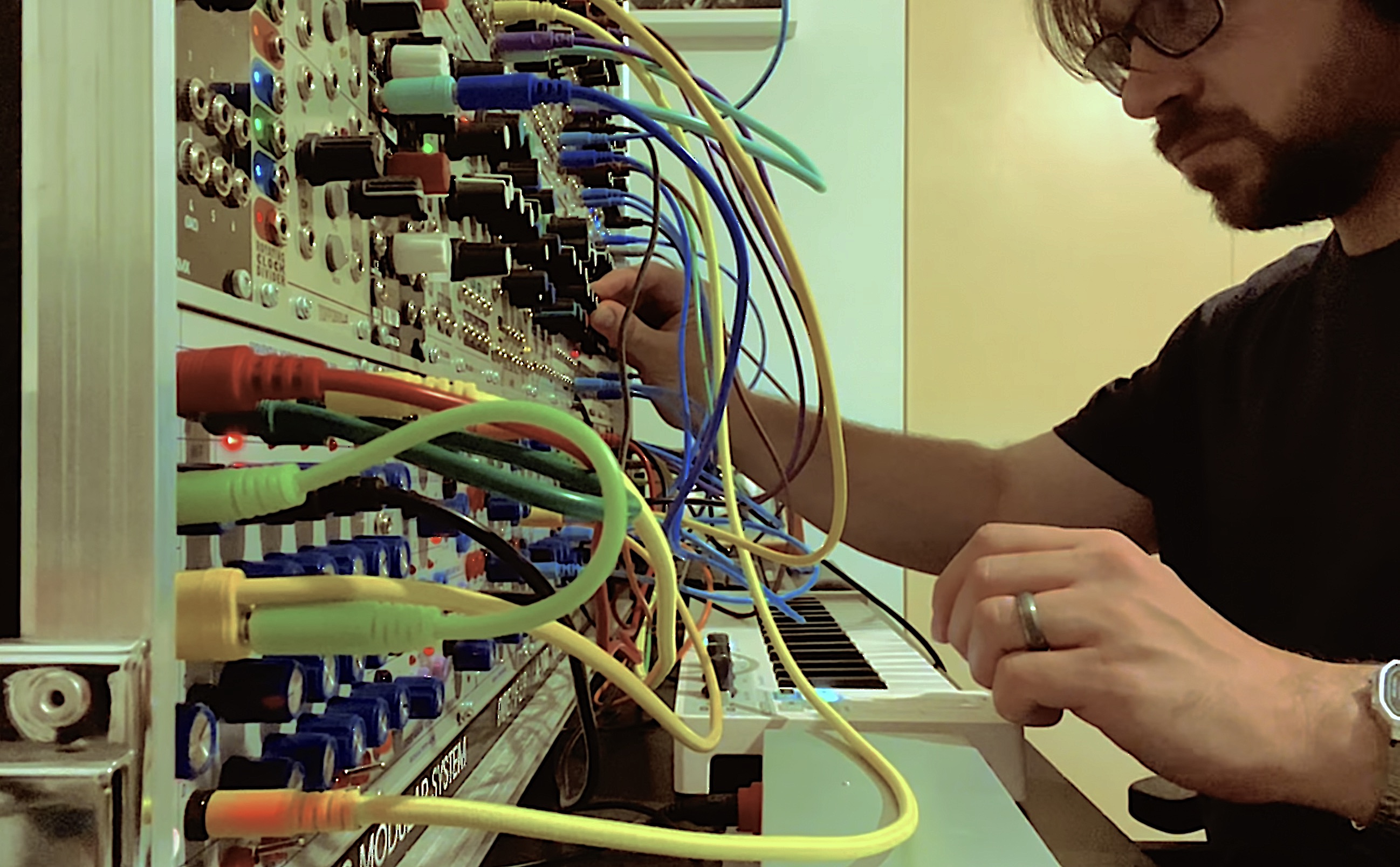 Ryan C. DeNardis at a eurorack modular synthesizer.
