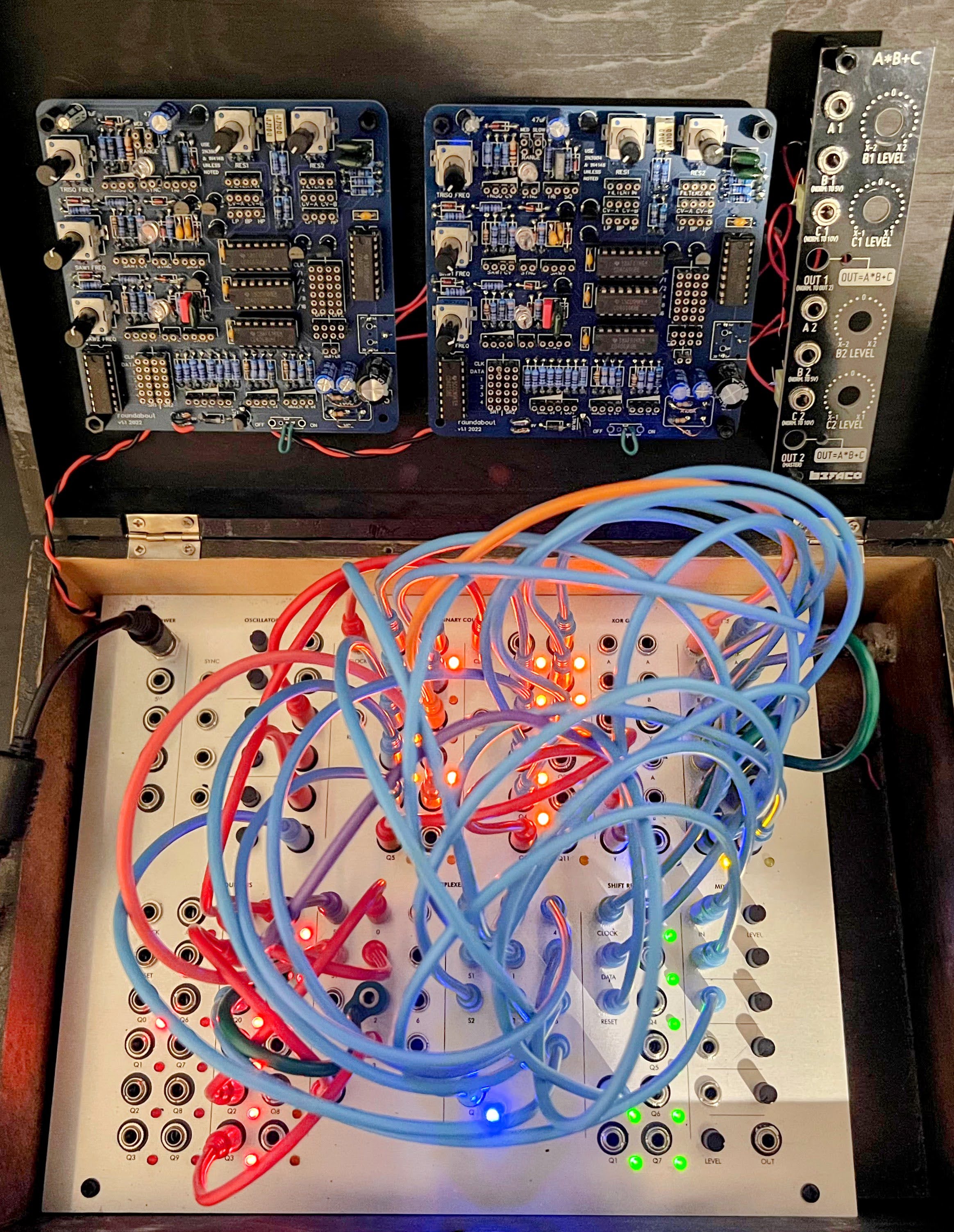 Blackbox containing three circuits screwed to the lid and bottom.